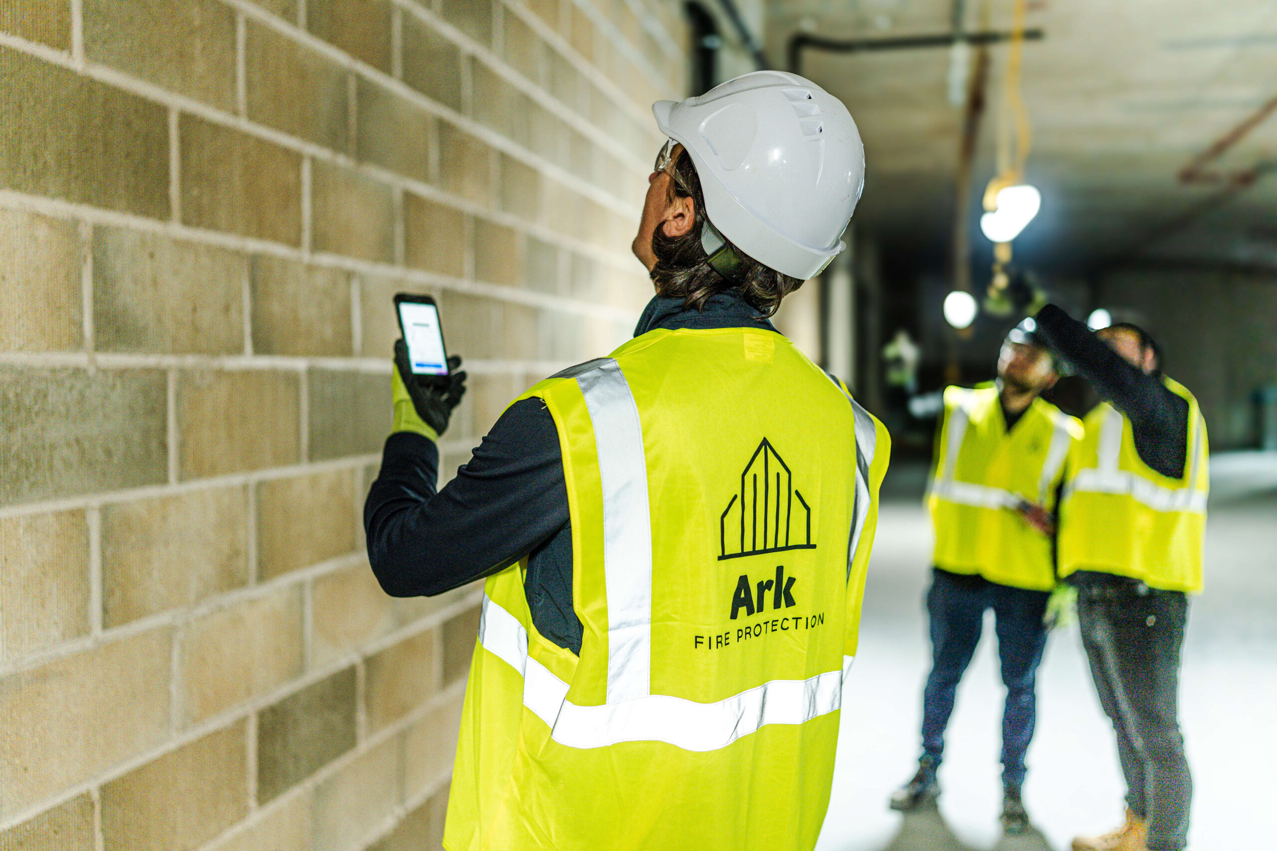Ark team member checking works on the One Trace App.