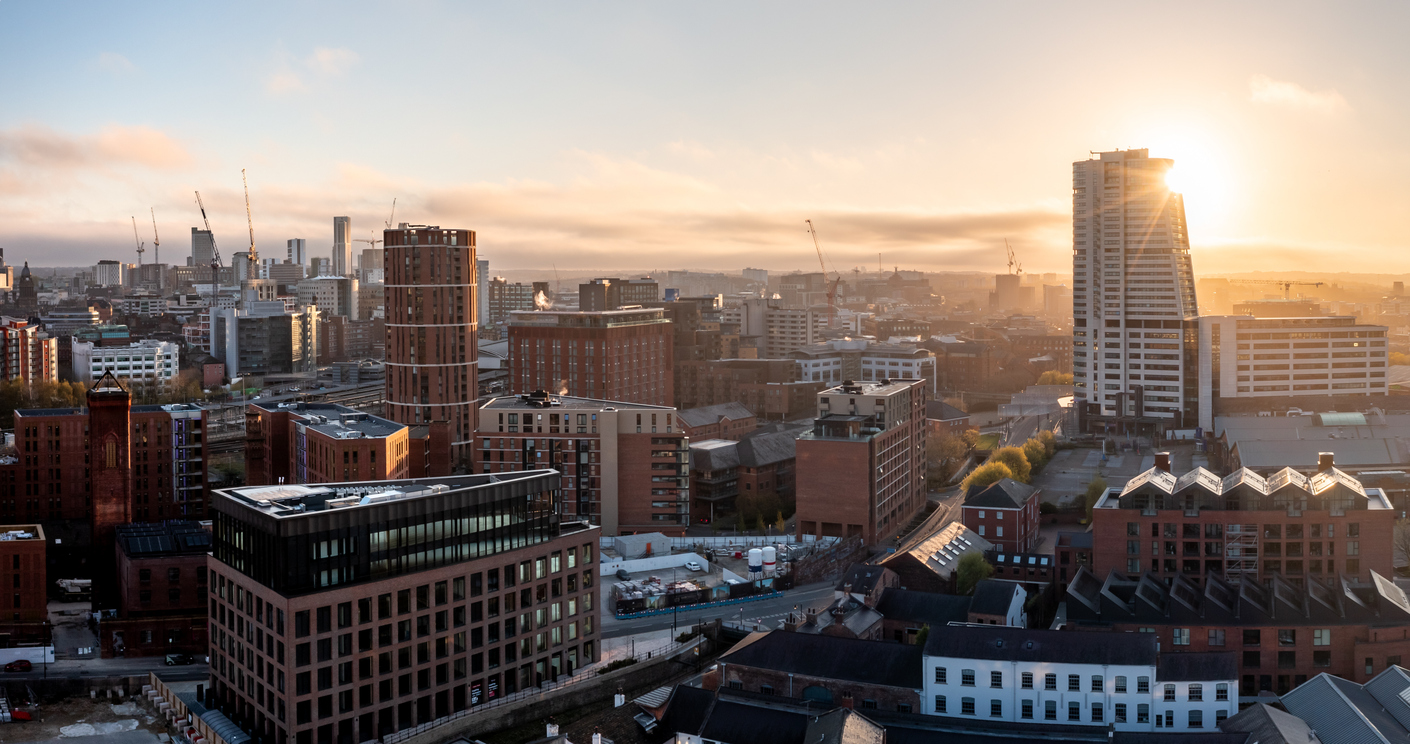 Aerial panorama of Leeds cityscape skyline with an early morning sunrise